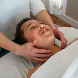 Child receives pediatric massage therapy at Whole Being Massage